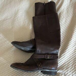 Dark brown leather upper Nine West boots with buckle wrap accent.